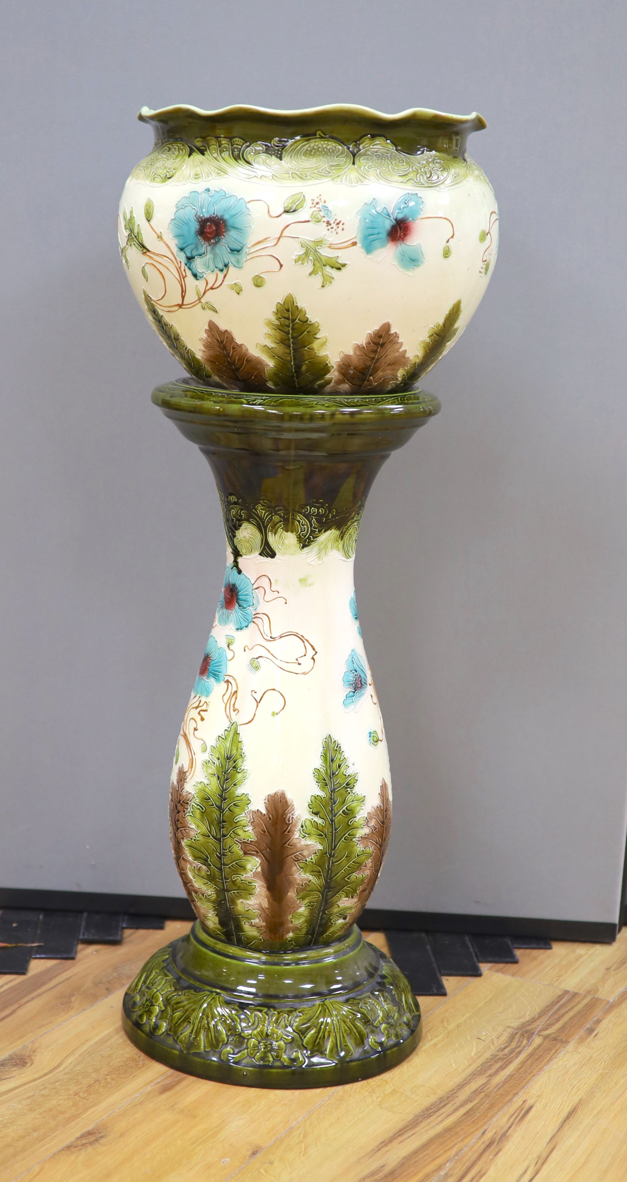 A Burmantofts style 'poppy' jardiniere and stand, total height 96 cm